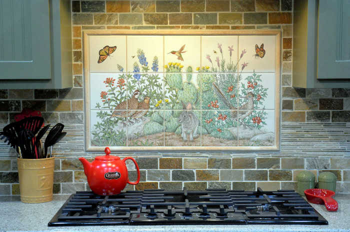 Pattys Texas Hill Country Garden kitchen tile mural, installed, with decorative bordering field tiles. Artist Julia Sweda.