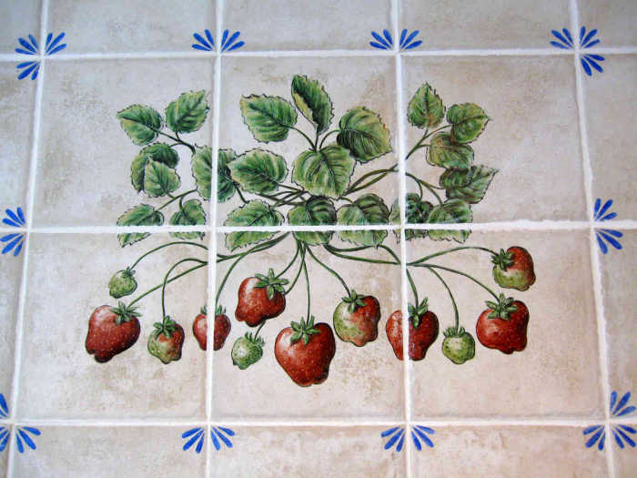 European Style Country Kitchen, view of strawberries attached to leaves of the plant, vignette.