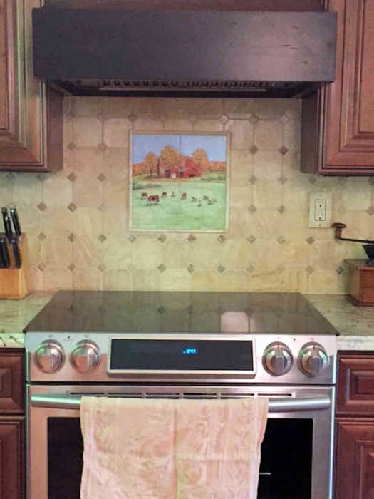 Annes Country Kitchen Animals, Red Barn Vignette and decorative field tiles installed as backsplash. Artist Julia Sweda.