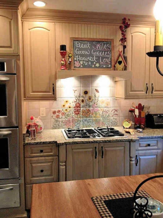 Debbie and Roccos Flower Garden tile mural, installed behind cooktop as a backsplash.