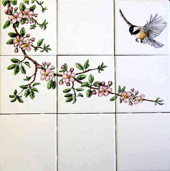 Skippers Floral Garden wall tiles mural, black-capped chickadee landing on branch of blossoming apple tree. Hand painted tiles by Julia Sweda.