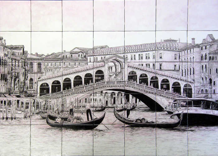 Scene of the world-renowned Rialto Bridge, busy Grand Canal, gondolas and other water vessels in Venice, Italy.