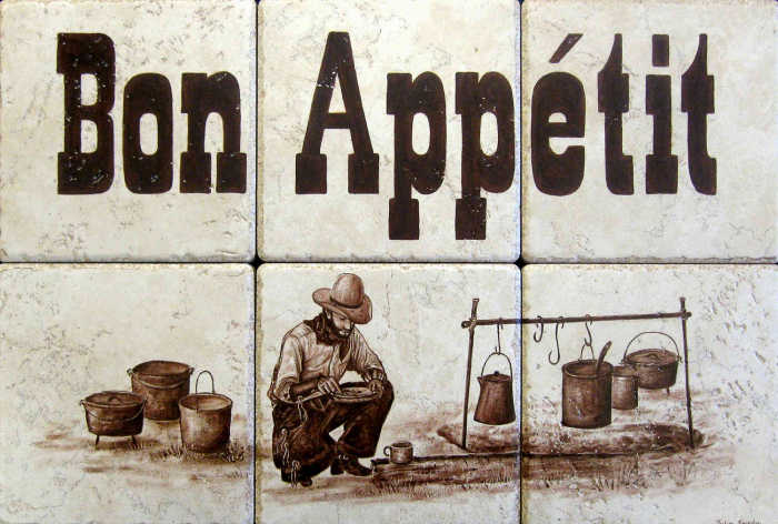 1909 Arizona ranch cowboy cooking over campfire, Bon Appetit in old west lettering.