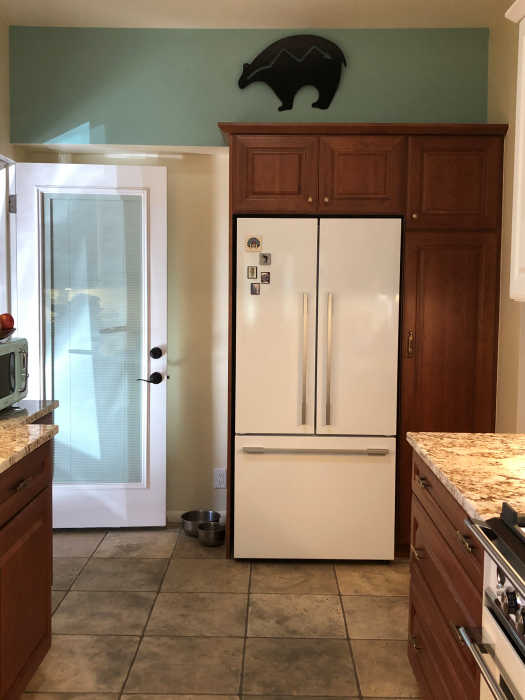First view of kitchen after completion of makeover. Refrigerator moved to another wall.