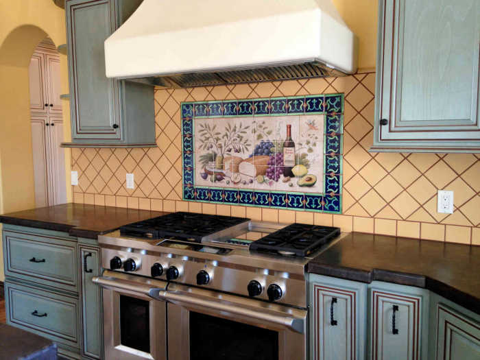 Allisons Greek Cuisine Wine Cheese Bounty Backsplash Tile Mural, view of kitchen decor with background field tiles set on the diagonal. Artist Julia Sweda.